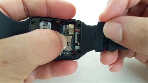 Where is SIM card tray for Q18 smart watch 